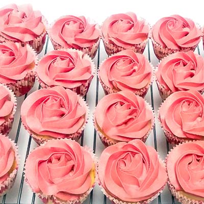 pink frosted cup cakes